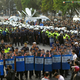 Hundreds of police in riot gear clear the streets surrounding the government Cabinet buildings occupied by student protesters in Taipei.
